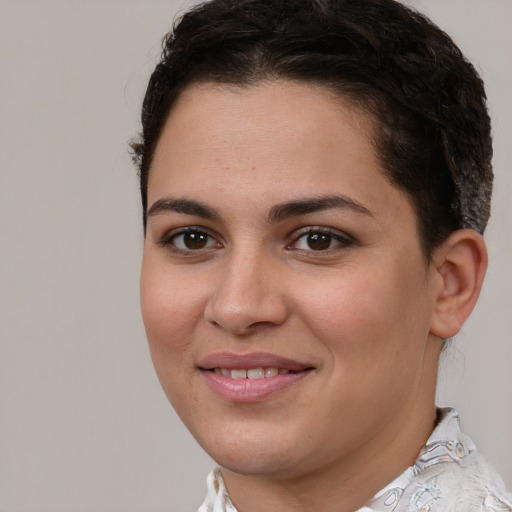 Joyful white young-adult female with short  brown hair and brown eyes