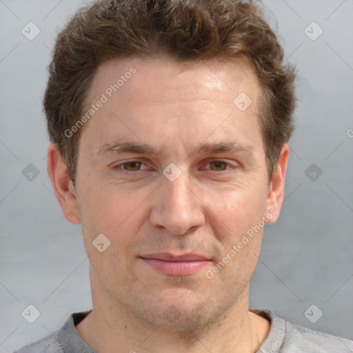 Joyful white adult male with short  brown hair and grey eyes