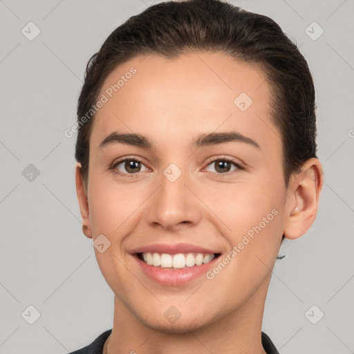 Joyful white young-adult female with short  brown hair and brown eyes