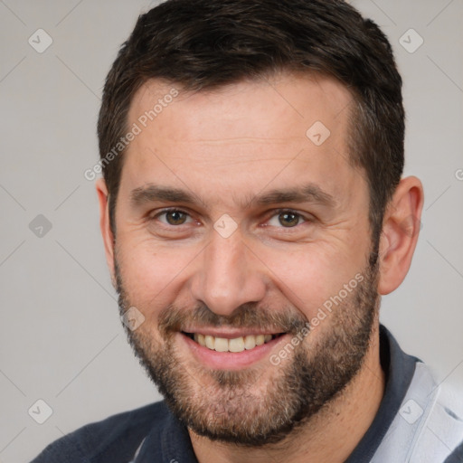 Joyful white adult male with short  brown hair and brown eyes