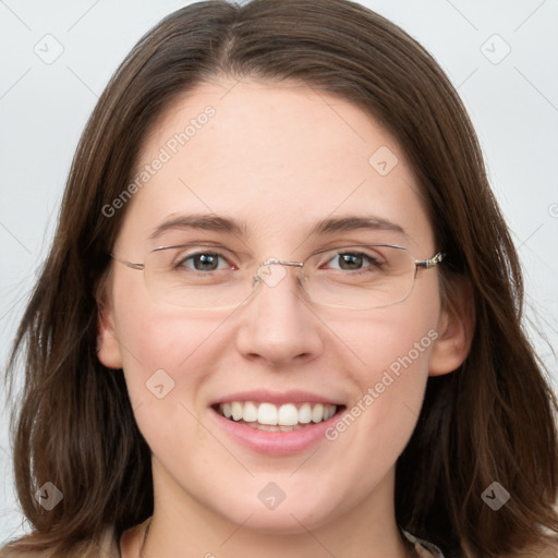 Joyful white young-adult female with long  brown hair and grey eyes