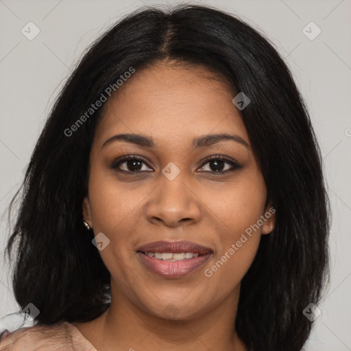 Joyful black young-adult female with long  brown hair and brown eyes