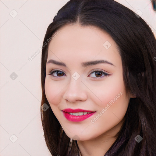 Joyful white young-adult female with long  black hair and brown eyes