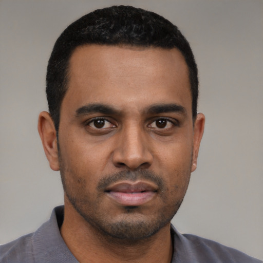 Neutral black young-adult male with short  black hair and brown eyes