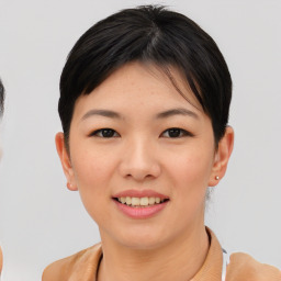 Joyful asian young-adult female with short  brown hair and brown eyes