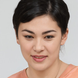 Joyful asian young-adult female with short  brown hair and brown eyes