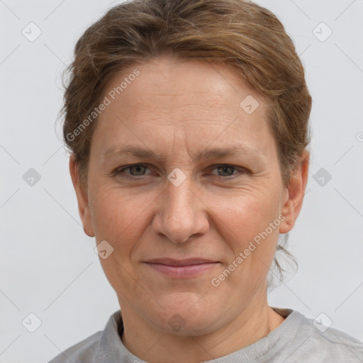 Joyful white adult female with short  brown hair and grey eyes