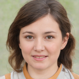 Joyful white child female with medium  brown hair and brown eyes