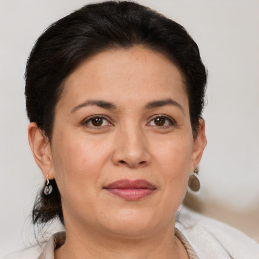 Joyful white adult female with short  brown hair and brown eyes
