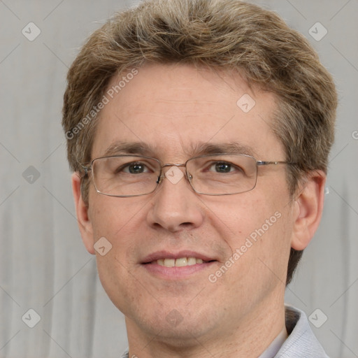 Joyful white adult male with short  brown hair and grey eyes