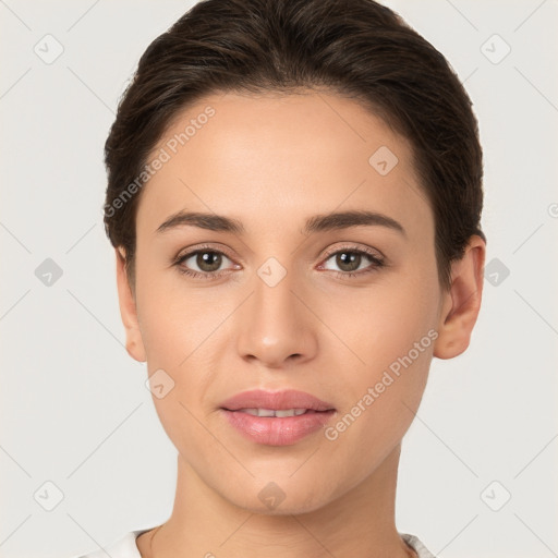 Joyful white young-adult female with short  brown hair and brown eyes