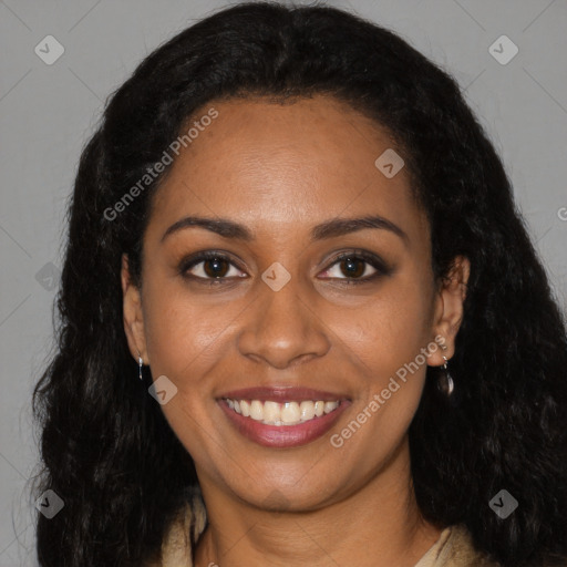 Joyful black young-adult female with long  black hair and brown eyes