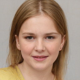 Joyful white child female with medium  brown hair and brown eyes