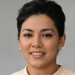 Joyful asian young-adult female with short  brown hair and brown eyes