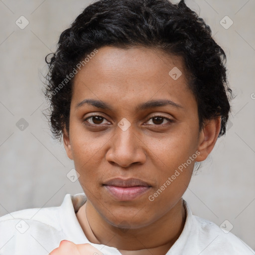 Joyful black young-adult female with short  brown hair and brown eyes