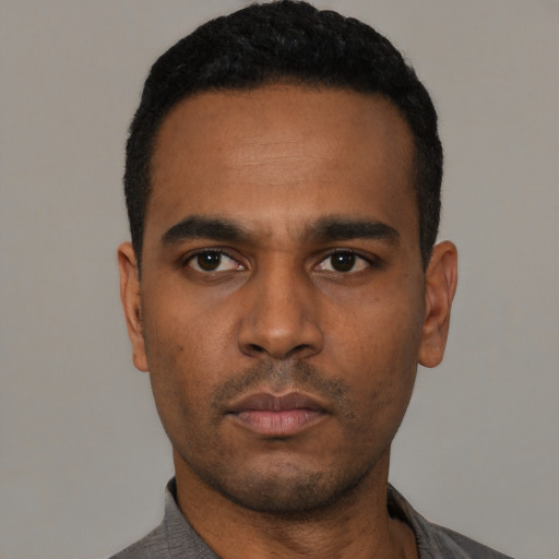 Neutral black young-adult male with short  black hair and brown eyes
