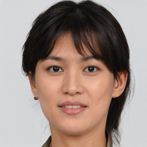 Joyful white young-adult female with medium  brown hair and brown eyes