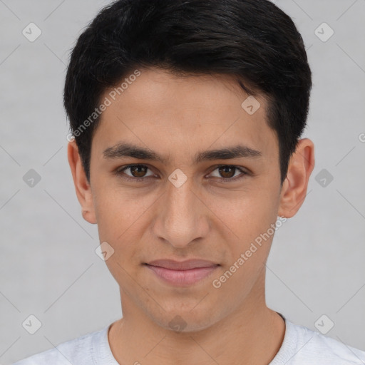 Joyful white young-adult male with short  black hair and brown eyes