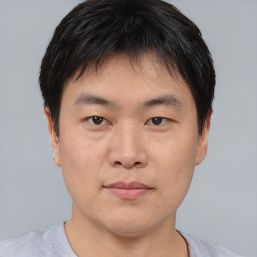 Neutral asian young-adult male with short  black hair and brown eyes