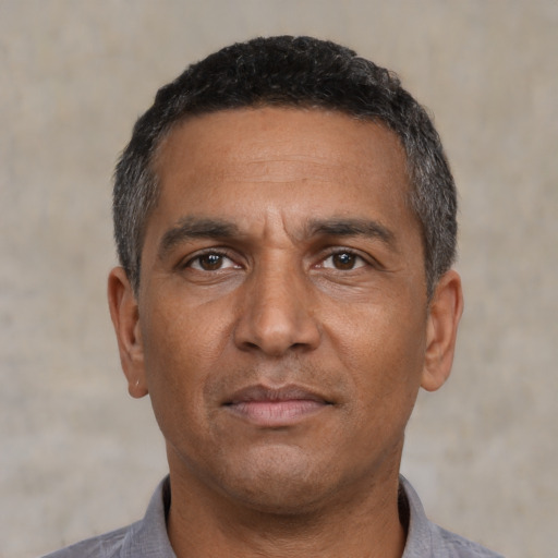 Neutral black adult male with short  black hair and brown eyes