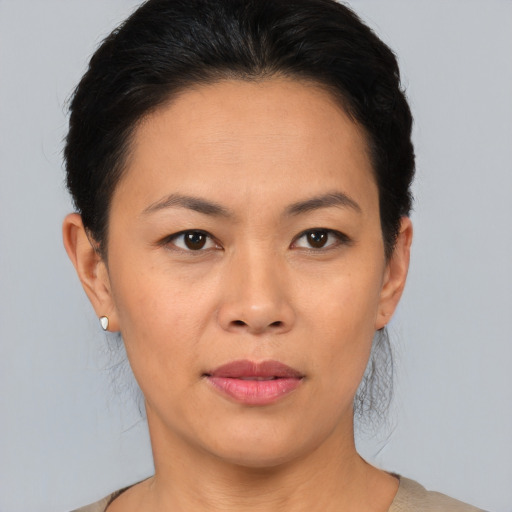 Joyful asian young-adult female with short  brown hair and brown eyes