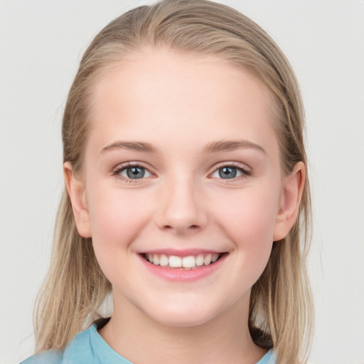 Joyful white child female with medium  brown hair and blue eyes