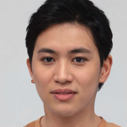 Joyful asian young-adult female with short  black hair and brown eyes