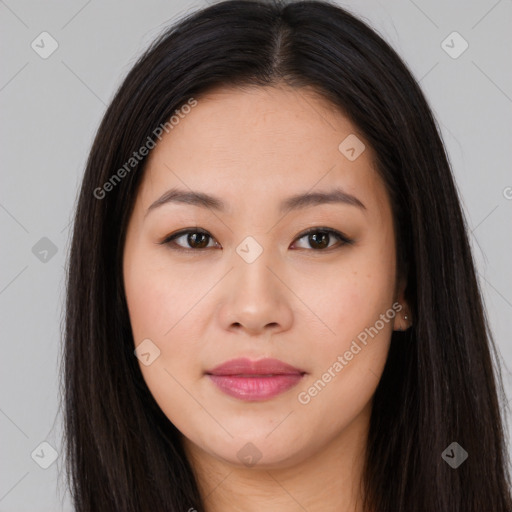 Joyful asian young-adult female with long  brown hair and brown eyes