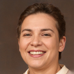 Joyful white adult female with short  brown hair and brown eyes