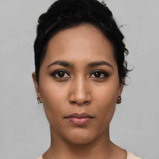 Neutral latino young-adult female with short  black hair and brown eyes