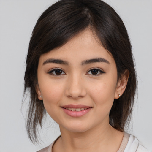 Joyful white young-adult female with medium  brown hair and brown eyes