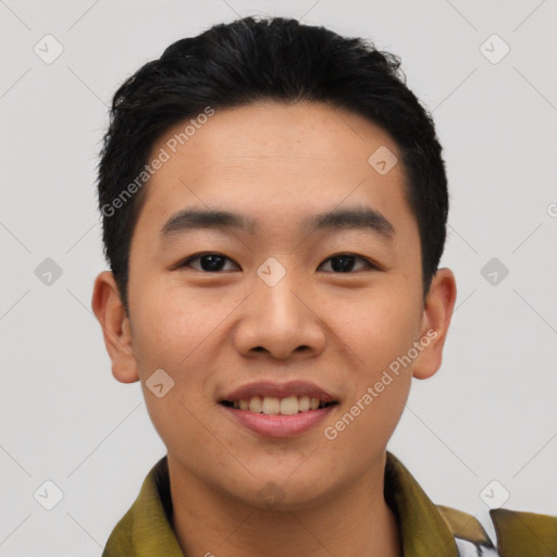 Joyful asian young-adult male with short  black hair and brown eyes