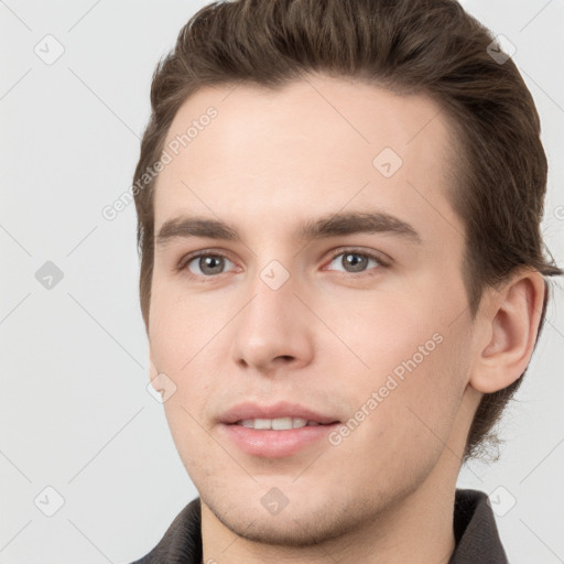 Neutral white young-adult male with short  brown hair and brown eyes