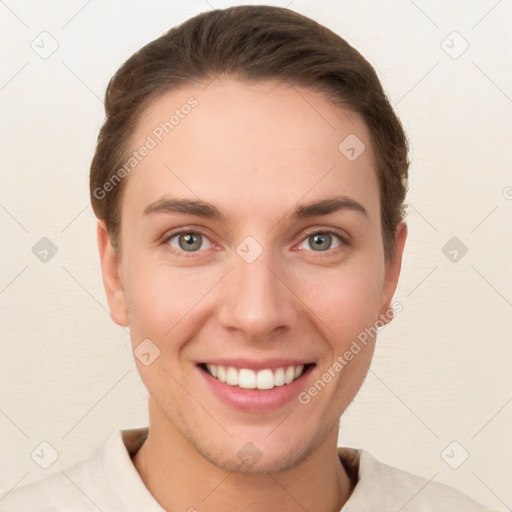 Joyful white young-adult female with short  brown hair and grey eyes