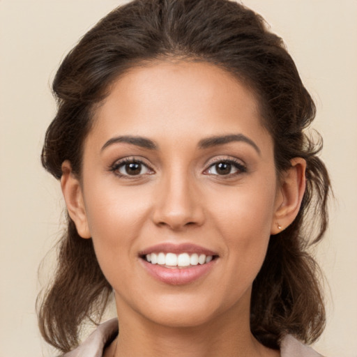 Joyful white young-adult female with medium  brown hair and brown eyes