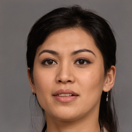 Joyful asian young-adult female with medium  brown hair and brown eyes