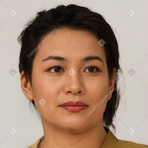 Joyful latino young-adult female with short  brown hair and brown eyes