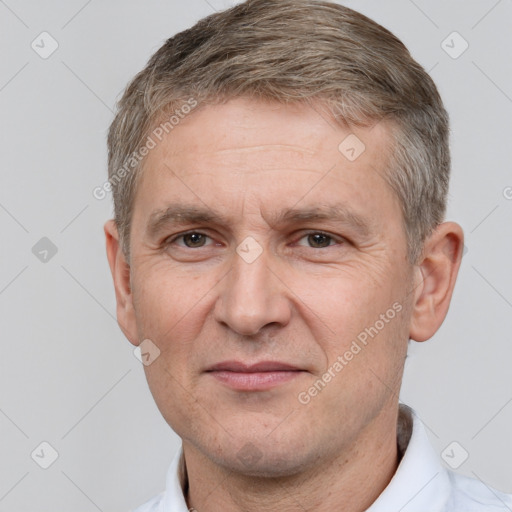 Joyful white adult male with short  brown hair and brown eyes