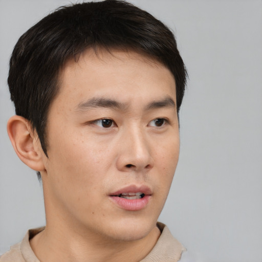 Neutral asian young-adult male with short  brown hair and brown eyes