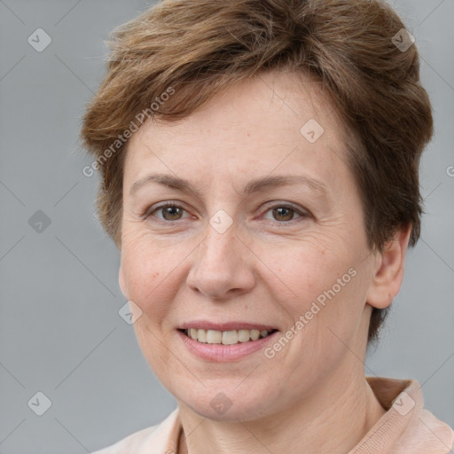 Joyful white adult female with short  brown hair and brown eyes