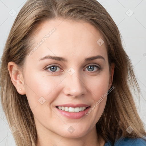 Joyful white young-adult female with long  brown hair and blue eyes