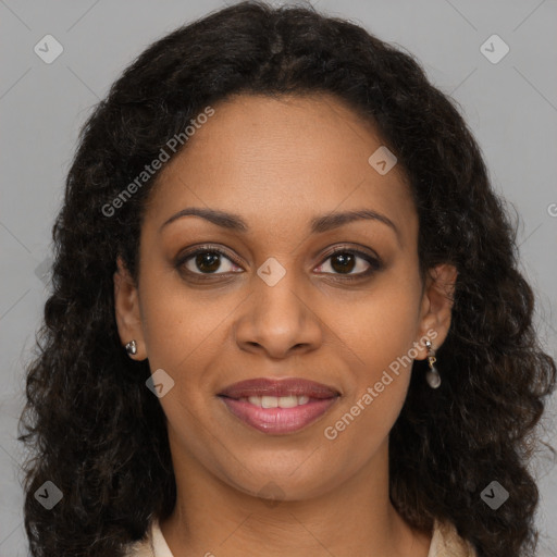 Joyful black young-adult female with long  brown hair and brown eyes