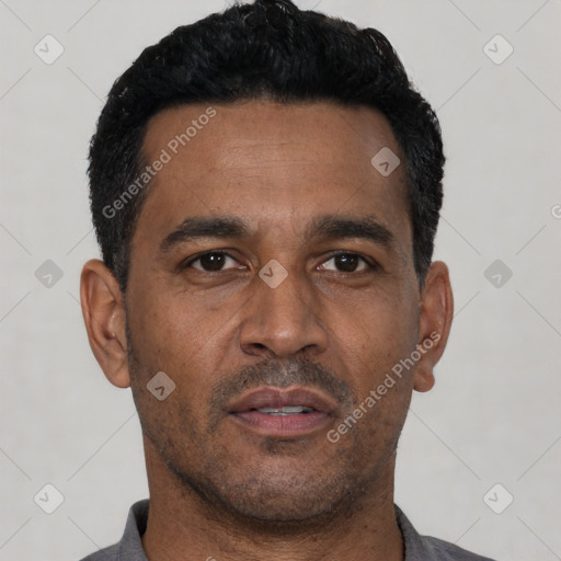 Neutral latino adult male with short  black hair and brown eyes