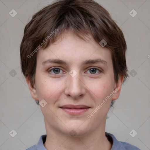 Joyful white young-adult female with short  brown hair and grey eyes