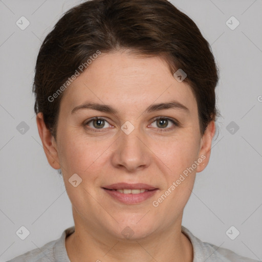 Joyful white young-adult female with short  brown hair and grey eyes