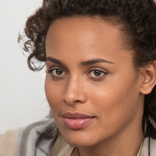 Neutral white young-adult female with medium  brown hair and brown eyes