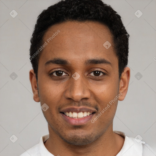 Joyful black young-adult male with short  black hair and brown eyes