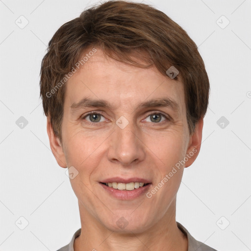 Joyful white adult male with short  brown hair and grey eyes