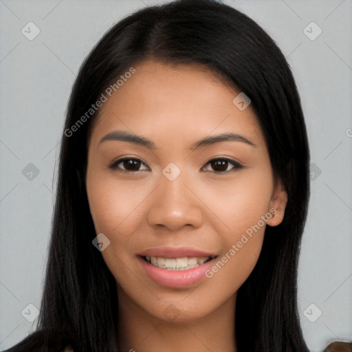 Joyful latino young-adult female with long  black hair and brown eyes