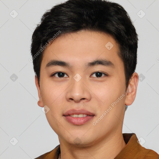 Joyful asian young-adult male with short  black hair and brown eyes